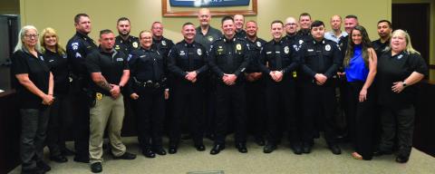 Ricky King (front row, center) was sworn in as the new Center Police Department Chief yesterday. King started his career as a patrolman before serving as a detective and eventually rising to be assistant chief. King will be taking over for retiring Chief Jim Albers (back row, center). David Danley | Light and Champion