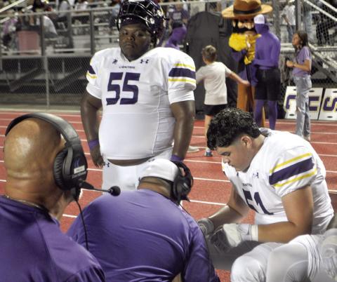 With their heads held high, the Center Roughrider defensive line gets some coaching during the meeting with rival Carthage last Friday night in Cartage. Dennis Phillips | Light and Champion