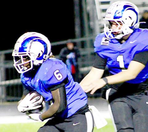 Running back Amarion Wilson (6) takes a handoff from quarterback Trenton Runnels in action in the Rams playoff contest with Elysian Fields. Wilson added 107 yards to the Rams dominant rushing attack against the Yellowjackets. Photo by Savannah Jordan JHS | Light and Champion