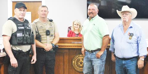 Shelby County welcomed two new constables this week with the appointing of Rowdy Green (second from right) to fill the unexpired term of former Pct. 4 Constable Taylor Fanguy and the hiring of Glen Dickerson (left) as Dept. Const. for Pct. 5. Joining in the swearing-in ceremony were John Pope, Const. Pct. 5 (second from left), and Const. Pct. 3 Roy Cheatwood. Lisa White | Light and Champion