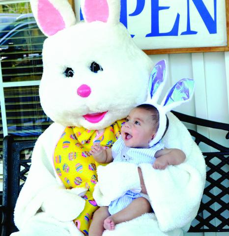Baby Grayson was one of the many little ones who visited Town and Country Real Estate on Friday, April 18, to take a picture with the Easter Bunny. Since 2008, Town and Country has been providing free Easter Bunny photos, along with cookies, popcorn, and this year, a chance to win Egg-citing prize eggs. Zack Clark | Light and Champion