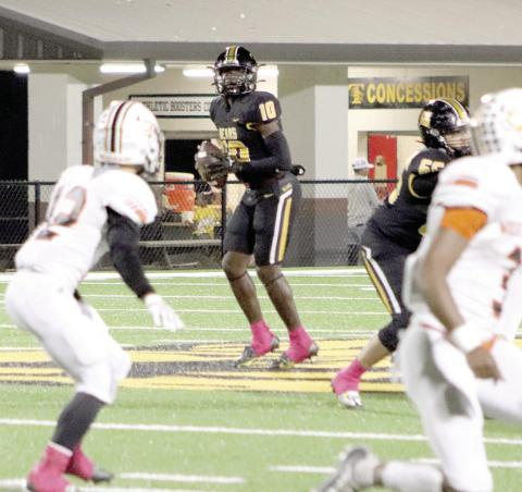 Terry Bussey stands in the pocket with excellent protection as he lets the play develop downfield. File photo by Taylor Bragg
