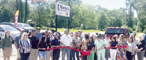 Family and well-wishers gathered to help Martin Cervantes celebrate the opening of his new tire shop on Highway 87 North in Center on Monday. Zack Clark | Light and Champion