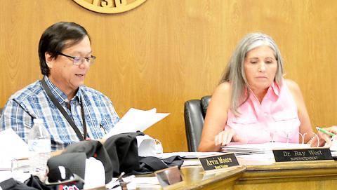 Shelbyville ISD Board of Trustees President Etola Jones listens as Superintendent Ray West delivers his superintendent’s report to the board at its Aug. 11 meeting. David Danley | Light and Champion
