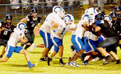 Ram Londell Parker looks for running room against a pack of Bulldog defenders in Joaquin’s 27-26 win over Corrigan-Camden last Friday night. Kelsi Wood | JHS