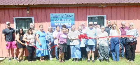 Terry Bridwell, owner of Plates of Grace, celebrates the opening of her new restaurant with the support of the Shelby County Chamber of Commerce, as well as many family members, friends and other supporters. David Danley | Light and Champion