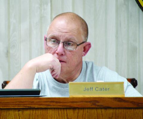 JISD board president Jeff Cater listens to a finance report from Joel Bumback at the board’s March meeting. Zack Clark | Light and Champion