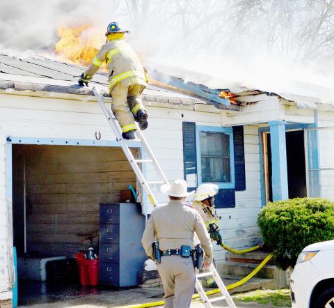 The Center Fire Department responded to a house fire on Santa Fe Street in Center shortly before noon Monday morning. The fire appeared to be confined to the attic area near one end of the home. Firefighters were able to quickly contain the blaze and bring it under control. They were assisted at the scene by CPD and DPS officers. David Danley | Light and Champion