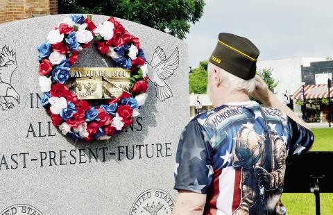 Members of VFW Post 8904 lay a wreath on the Shelby County Veteran’s Memorial on the grounds of the historic Shelby County courthouse in honor of D-Day. Zack Clark | Light and Champion
