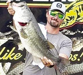 Louisiana angler Tater Reynolds reeled in the winning fish at the 41st Annual Big Bass Splash on Sam Rayburn, an 11.48 pounder. He banked more than $150,000 in cash and prizes. Sealy Outdoors Photo