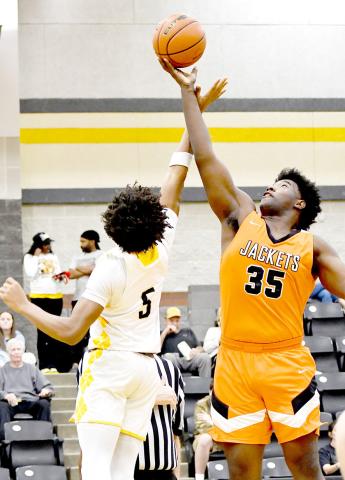 Timpson’s Albert Parker tangles with an Elysian Fields player in a struggle for a rebound during the Bears’ game against the Yellowjackets in a district game. Timpson ISD | Light and Champion