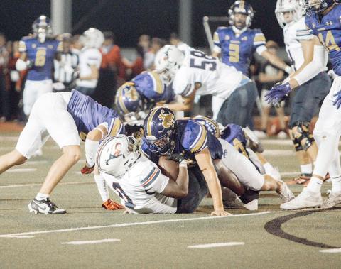 Roughrider defense sticking a tackle and pinning the Mustangs. Lainee Cooper | Light and Champion