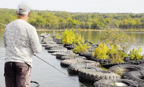 Man-made breakwaters like this row of tires can be magnets for bass because of the cover and shade they provide. Photo by Matt Williams