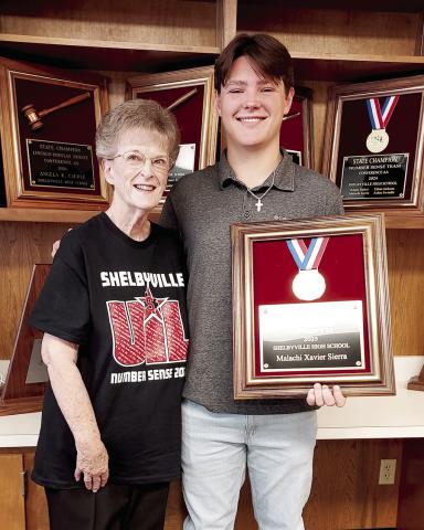 While not counting toward the Lone Star Cup because it was an individual award, Malachi Sierra’s first place triumph in Number Sense at the state UIL meet is a reflection of the commitment to excellence the district strives for. Sierra was coached by Cole Harrison and presented with his award by Esther Harrison at the July 10 Shelbyville ISD board meeting. David Danley | Light and Champion
