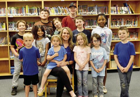 Principal Roni Waller is surrounded by some of Excelsior ISD’s students in the school’s library. The school has been experiencing significant growth recently and is poised for more exciting things to come. David Danley | Light and Champion