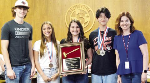 Several Shelbyville High School students were recognized at this month’s school board meeting for their accomplishments in debate competition. They were (left to right) Gaylon Harrison, Kennedy McArthur, Maddie Lout (state champion in Congress) and Travis Caporali. With them is their debate and speech coach, Emily Sowell. David Danley | Light and Champion