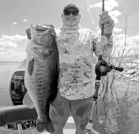 Leroy Boss with the 14.85 pounder he caught off a spawning bed recently while fishing at Lake O.H. Ivie with Hill Country Hammers Guides and Outfitters. (Photo courtesy of Jerad Pool)
