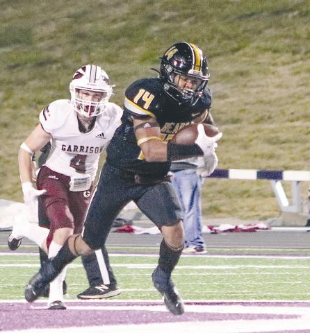 #14 Tyler Lane heads to the end zone against Garrison, just one stop on the road to the big show. Taylor Bragg | The Light and Champion