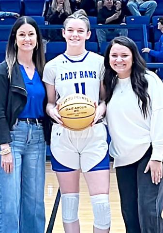 Joaquin senior Ellie Anglin has surpassed 1,000 points in her career. With Anglin are her coaches Mindy Bragg (left) and Katelyn Martinez Harris. Submitted | Light and Champion