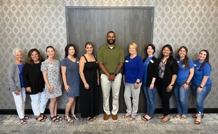 Shelby County Children's Advocacy Center staff smile for a photo with guest speaker Gaelin Elmore after Tuesday's presentation. (Submitted photo) 