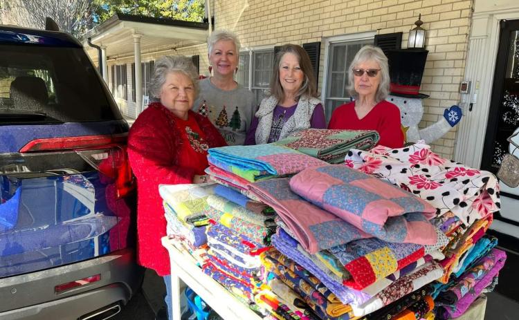 Scrap Happy Quilters bring quilts to Holiday Nursing residents
