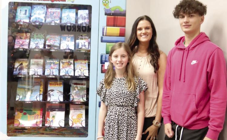 Camille Copelin and family with the new Inchy’s Bookworm Vending Machine Submitted Photo | The Light and Champion