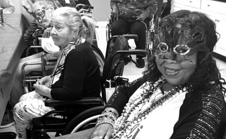 Focused Card celebrates with Mardi Gras decorations. Staff and residents were all smiles.