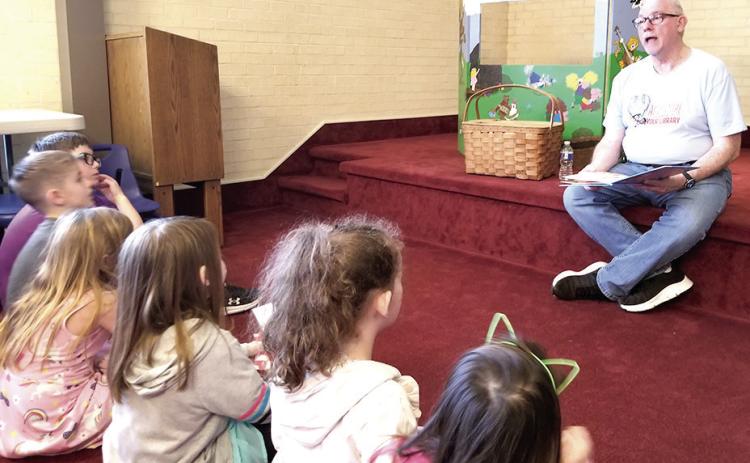 Mr. Roy reading to the kiddos that attended the first annual Take Your Child to the Library Day” at the Fannie Brown Booth Memorial Library. Submitted Photo