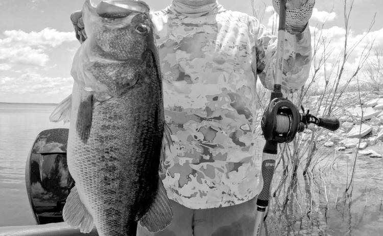 Leroy Boss with the 14.85 pounder he caught off a spawning bed recently while fishing at Lake O.H. Ivie with Hill Country Hammers Guides and Outfitters. (Photo courtesy of Jerad Pool)