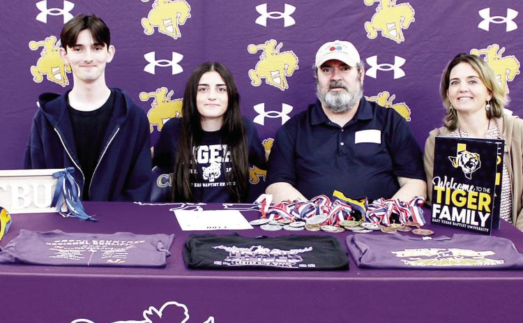 Center High School student Rachel Newton has signed with East Texas Baptist University to continue her track and cross country career. With Rachel at her signing ceremony were her parents, David and Rebecca Newton, and her twin brother, Nathan Newton. Rachel was coached by Coach Smith and Coach Garcia. Submitted | Light and Champion